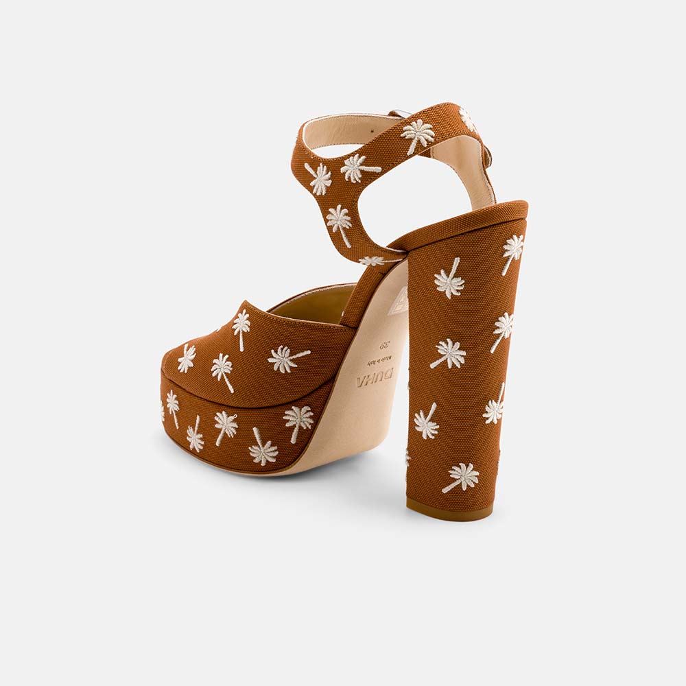 Back view of DUHA Palmdance caramel showing ankle strap and embroidered block heel