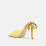 Back view of DUHA Palmira Mule light yellow patent showing gold palm tree heel