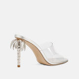 Back view of DUHA Palmira Mule transparent showing metallic palm tree heel detail