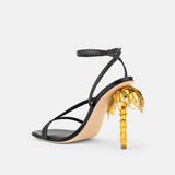 Back view of DUHA Palmira Sandal black showing ankle strap and gold palm tree heel
