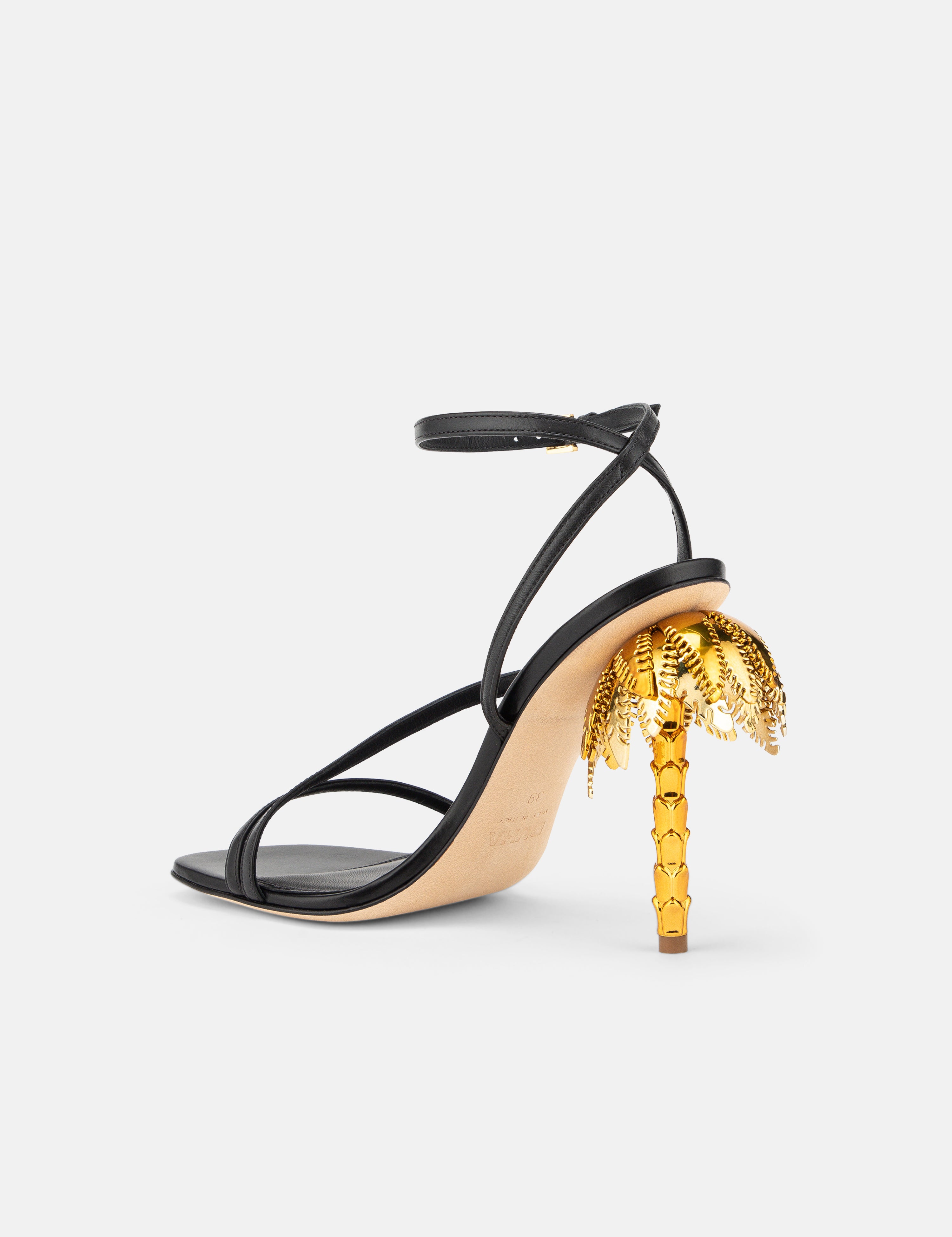 Back view of DUHA Palmira Sandal black showing ankle strap and gold palm tree heel