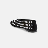 Close-up of mixed-cut crystal embellishment and circular 
cutouts on DUHA Yasmin black flat