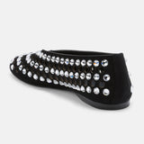 Close-up of mixed-cut crystal embellishment and circular 
cutouts on DUHA Yasmin black flat