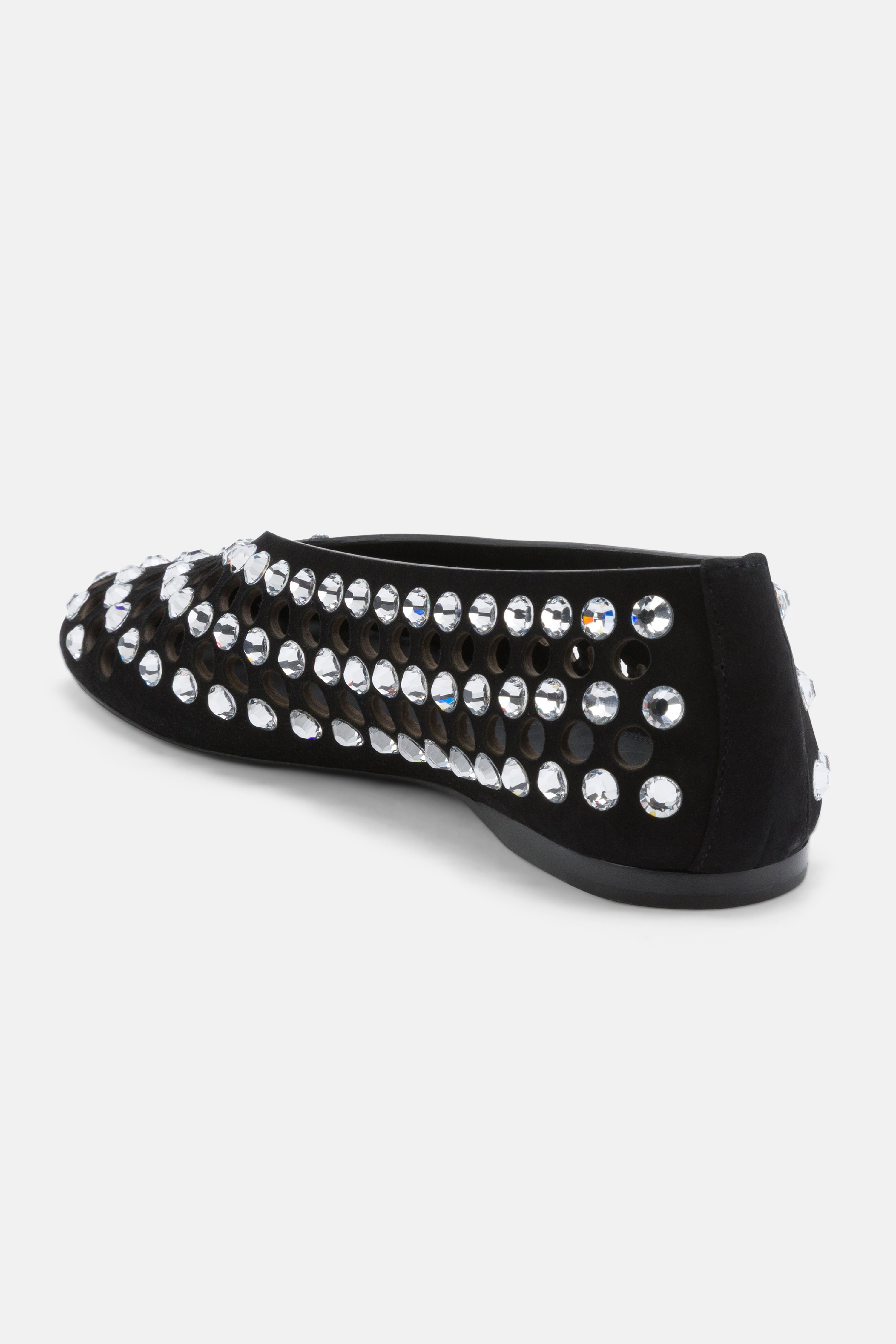 Close-up of mixed-cut crystal embellishment and circular 
cutouts on DUHA Yasmin black flat